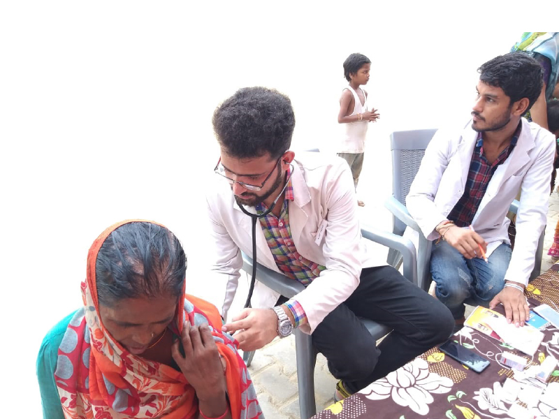 A patient being examined at the medical camp.