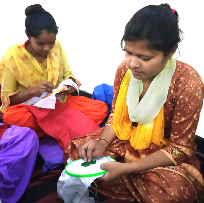 Women learning embroidery.