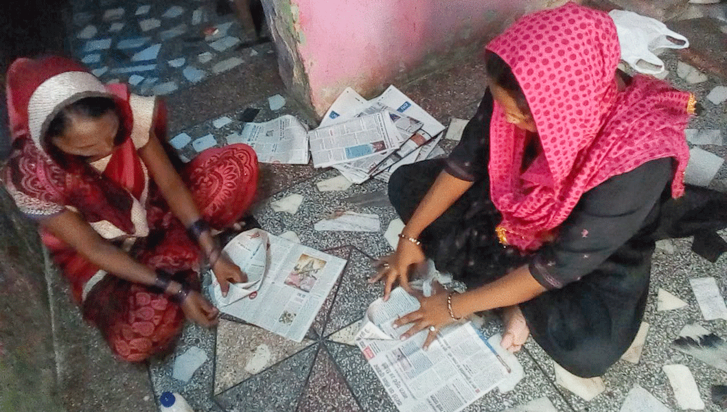 Women making paper bags.