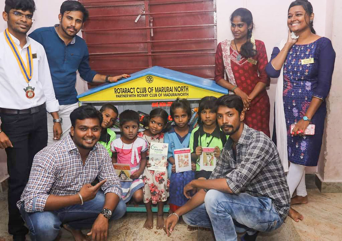 RAC Madurai North president K Madhusudhan (sitting, left) along with Rotaractors at a Little Library. Also seen is immediate past president E Vigneshwaran (left).