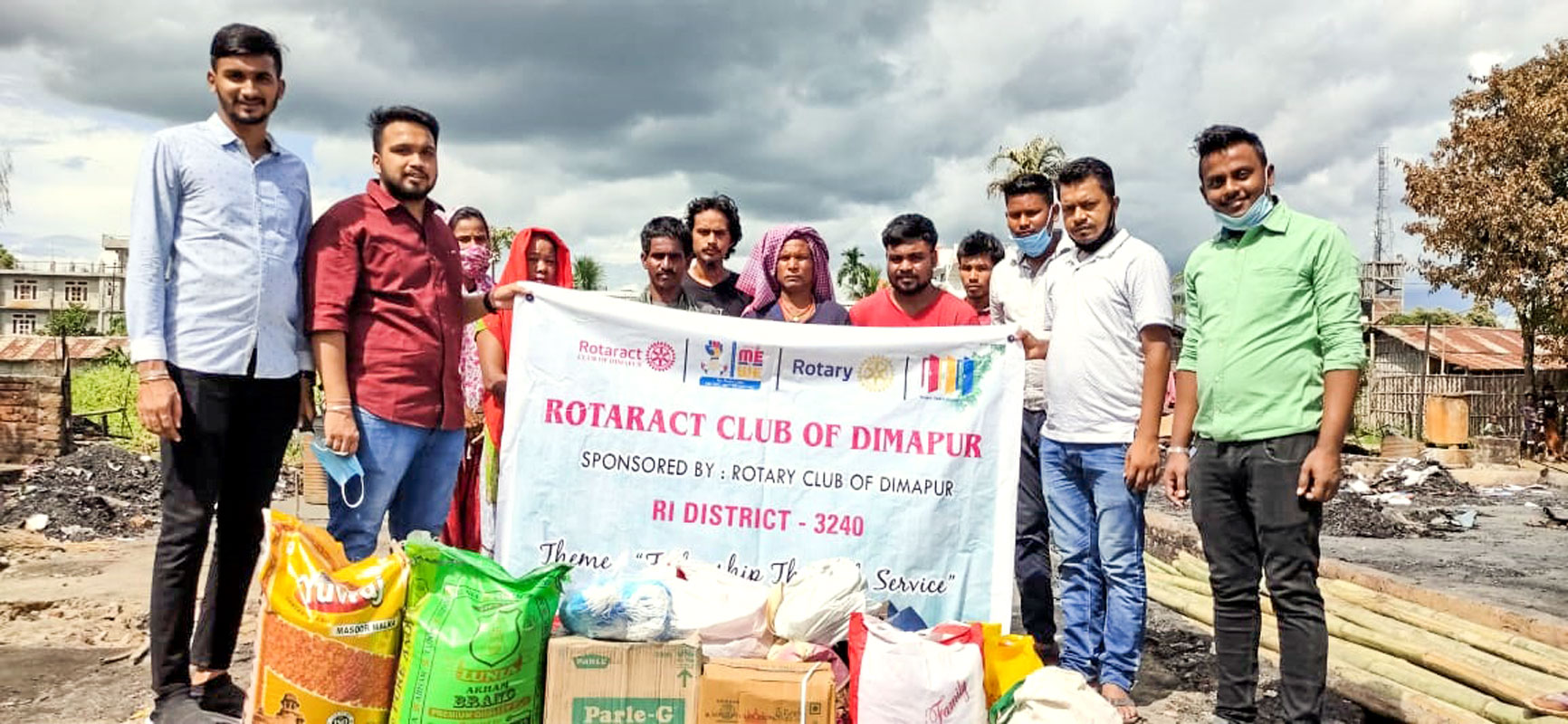 Rotaractors with grocery items and essentials for seven families who were victims of a fire mishap.