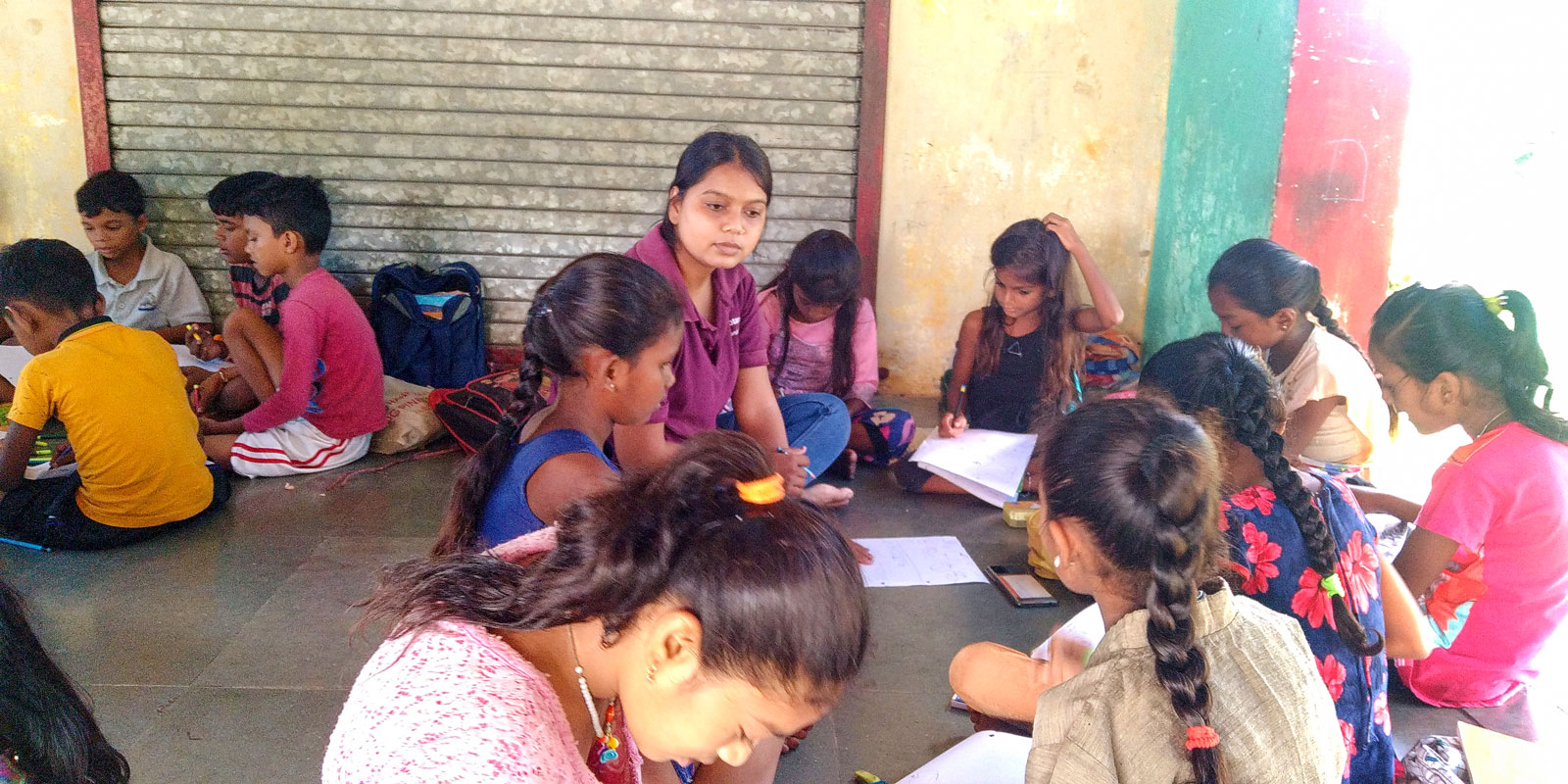 A Rotaractor teaching rural children.