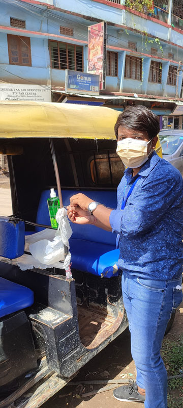 RAC Dimapur president Ashok Jain fitting a hand sanitiser in an autorickshaw. 