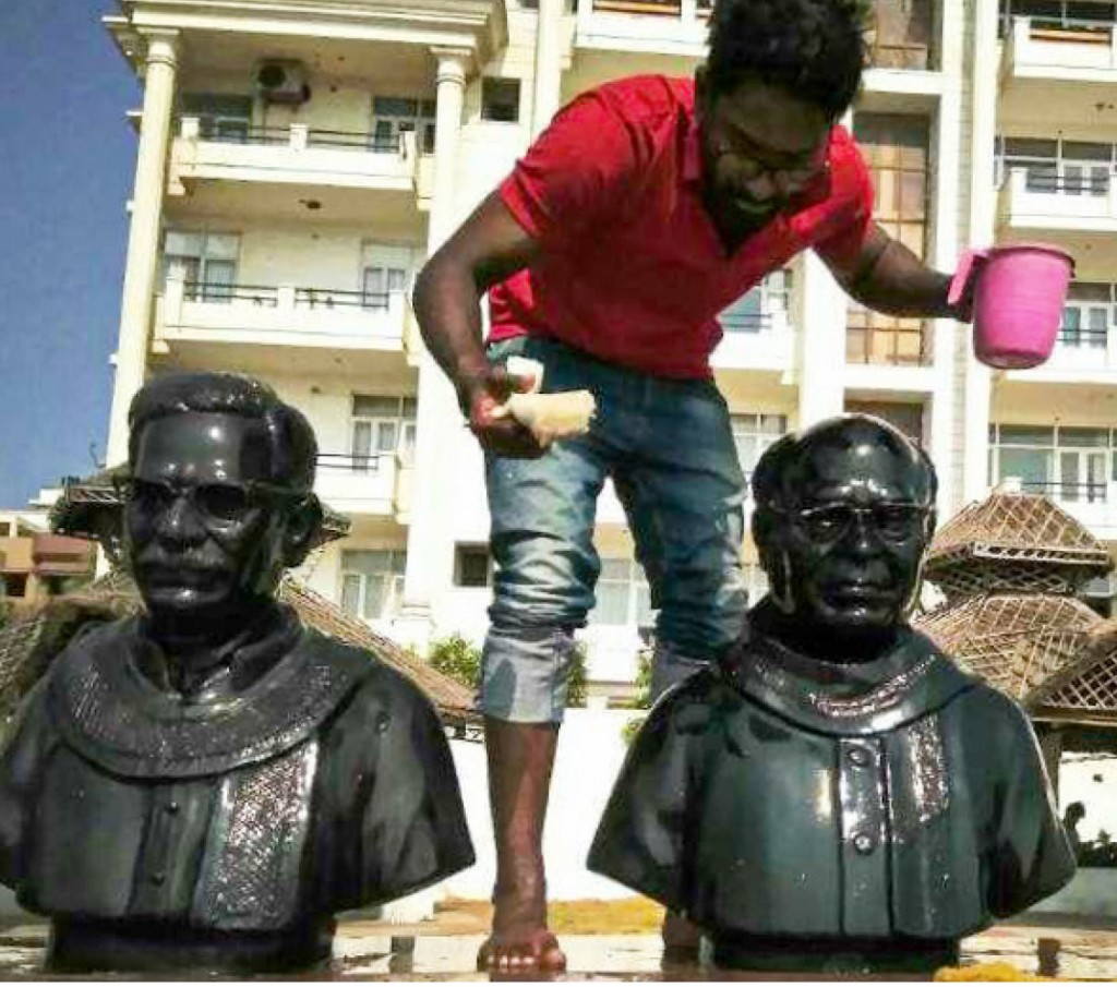 DRR Venkata Gowtham Kalla cleaning statues on Beach Road at Vizag.