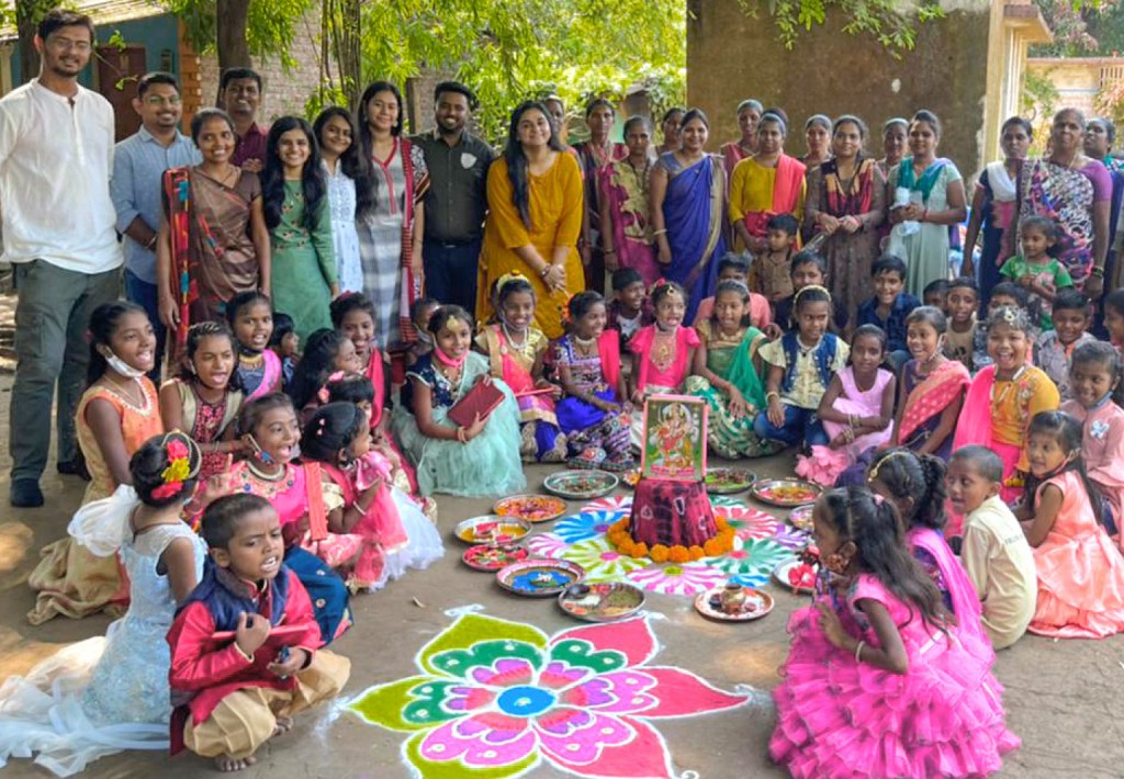 Rotaractors celebrate a religious festival with the villagers.