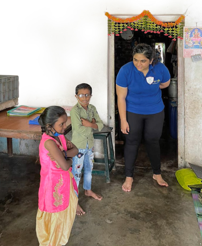 Club president Pooja interacting with children in the village.
