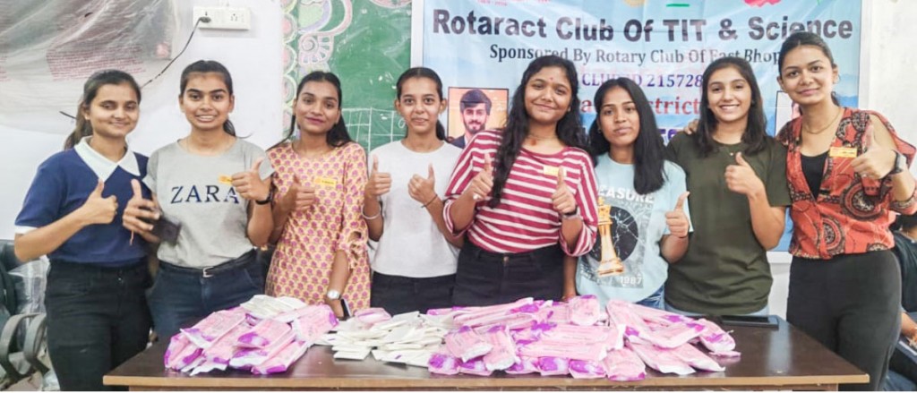 Rotaractors with sanitary napkin packets ready for distribution.