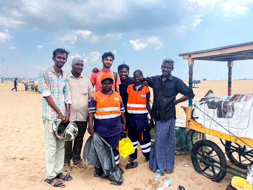 Members of RAC Saveetha School of Management with sanitary workers at the Marina Beach, Chennai. 