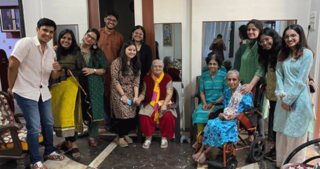 RAC Mumbai Mulund South secretary Mansha Dedhia (right, back row) and Rotaractors with elderly women at an old age home during Diwali.