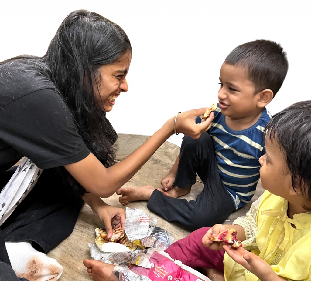 A Rotaractor feeds a child who lives in the slums of Jagruti Nagar in Mumbai.