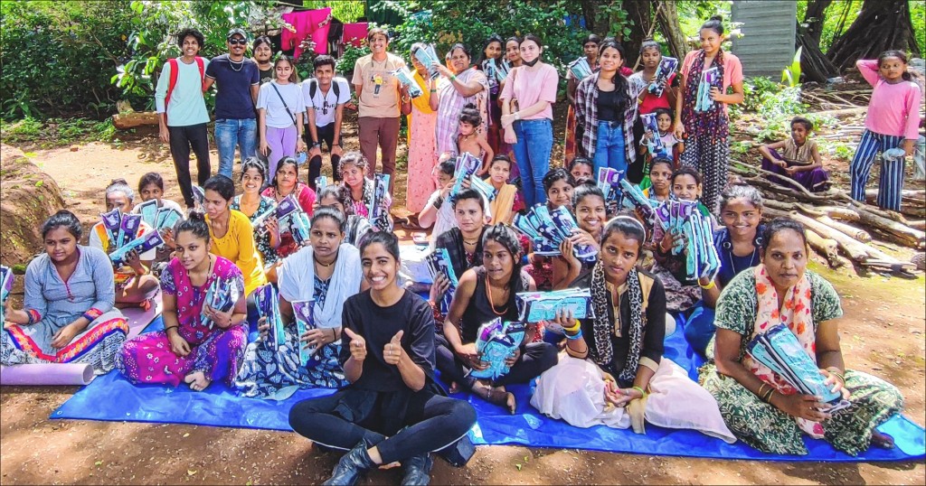 Rotaractors with the tribal women after distributing sanitary pads to them.