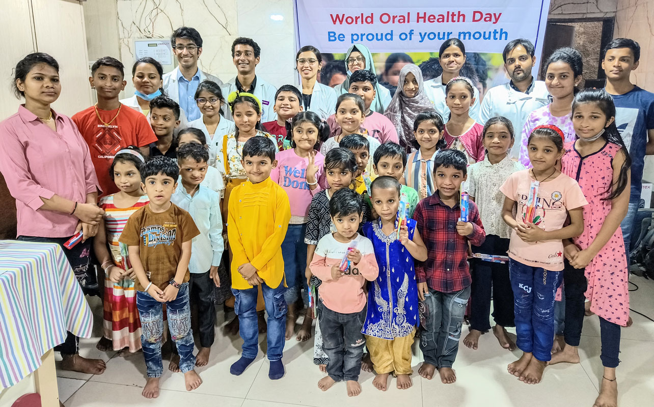Children with toothpastes and brushes after a dental check up.