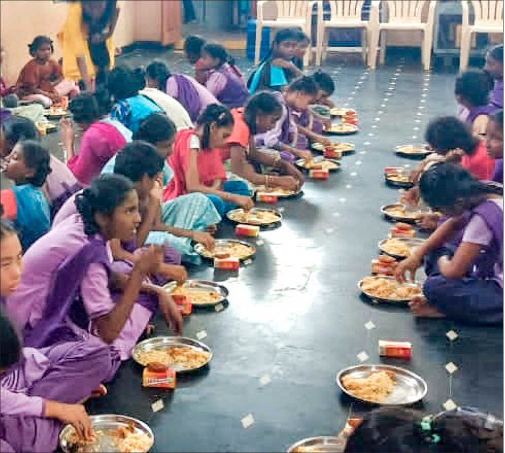 Children at the orphanage enjoying the meals served by the Rotaractors.