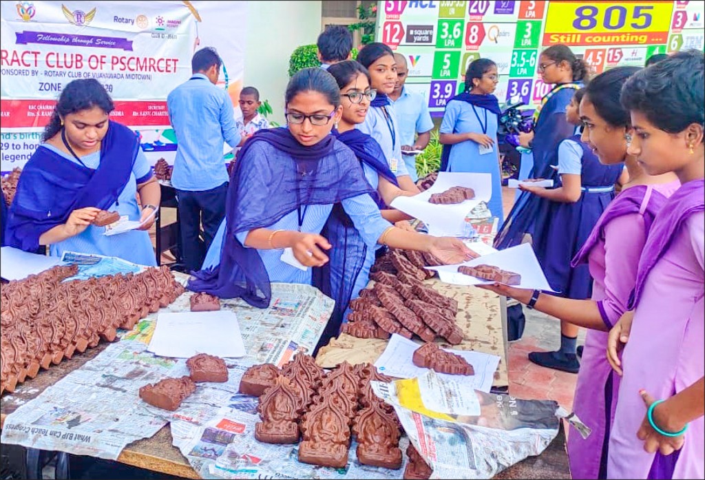 Eco-friendly Ganesh idols being distributed at a school