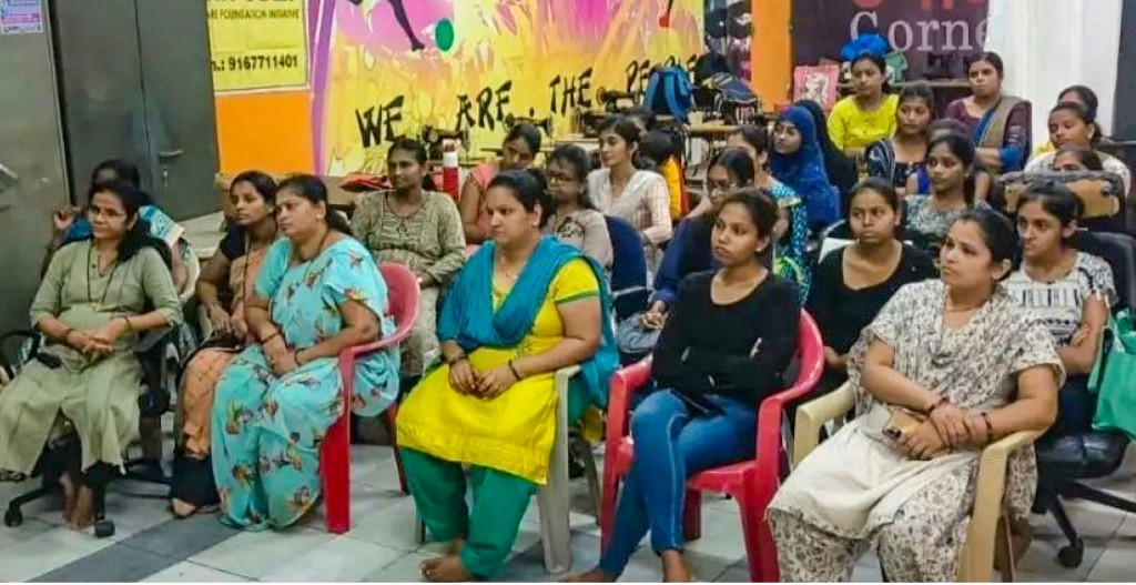 Women listen to a lecture on cybersecurity.
