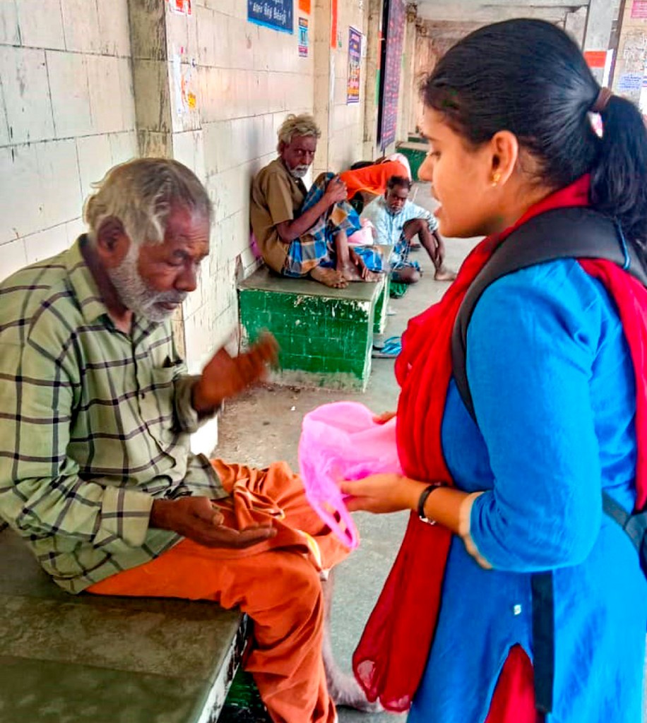 Food packets being distributed at a home for the aged.