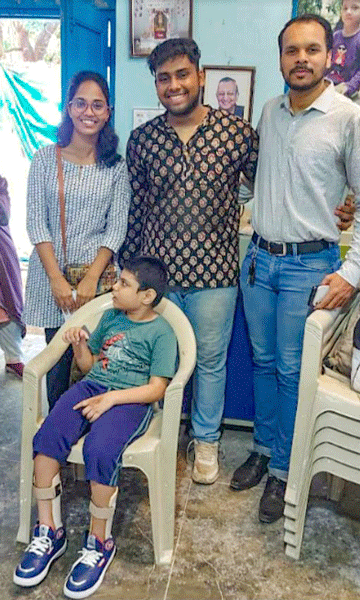 From L: Rtr Mansi Kante, RAC Thane Downtown president Rushikesh ­Bhadane and Rtr Pushkar Kulkarni, along with a young beneficiary, at the Jaipur foot distribution camp.