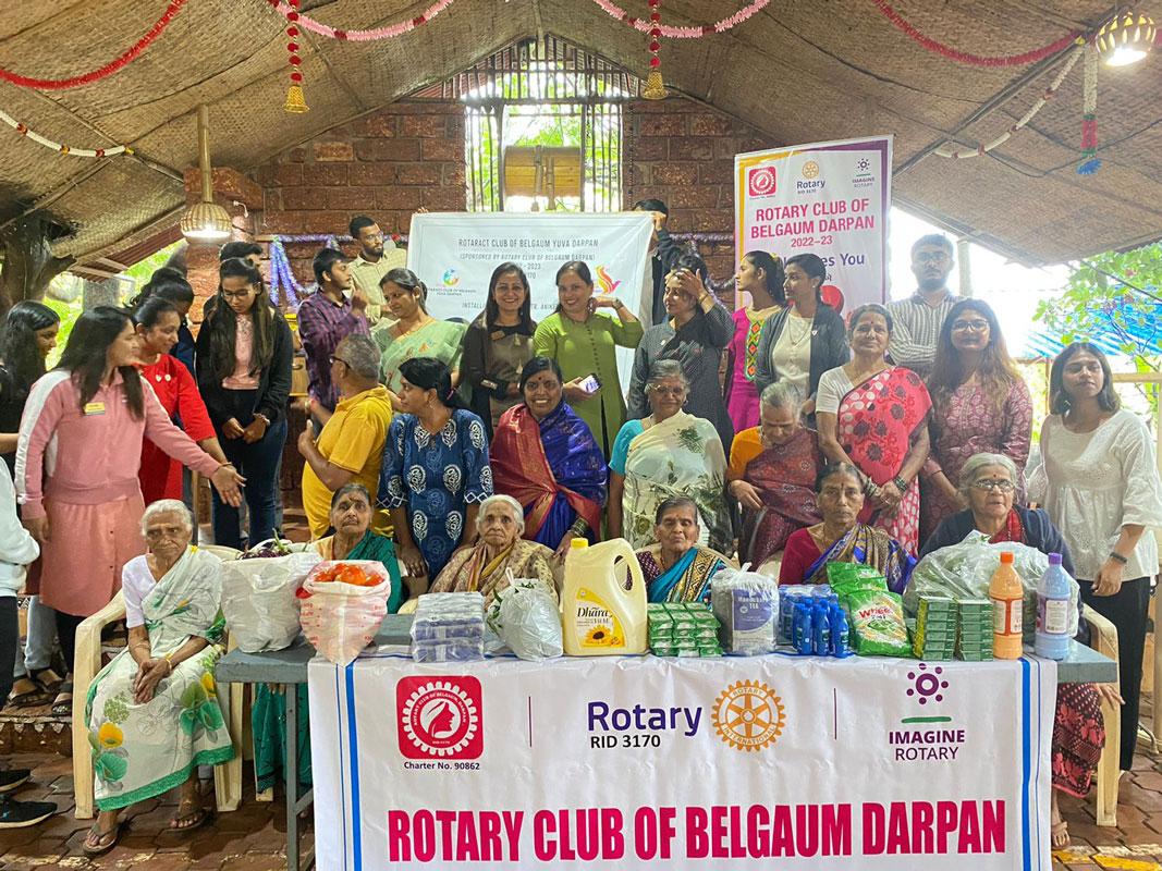 Rotaractors with the elderly inmates of the old age home after providing the home with monthly essentials.