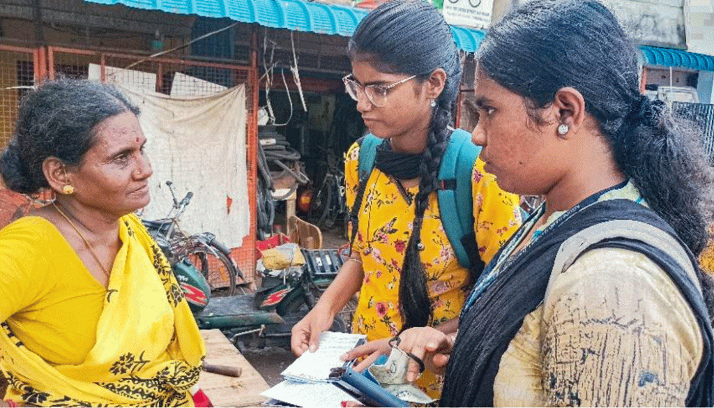 Rotaractors educate a housewife on her fundamental rights while distributing the dos and don’ts leaflets.