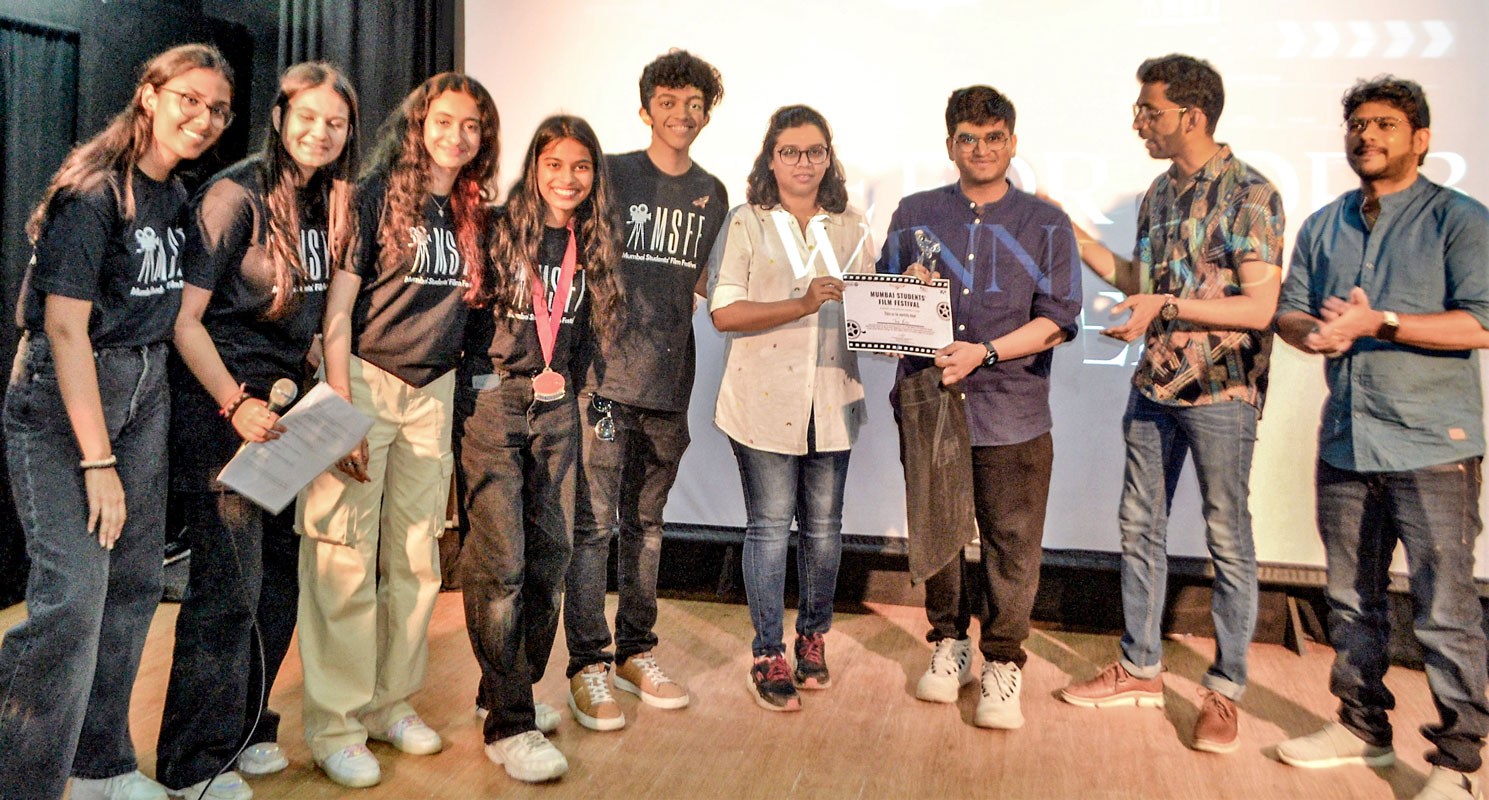The Mumbai Students Film Festival team felicitates a winner. 