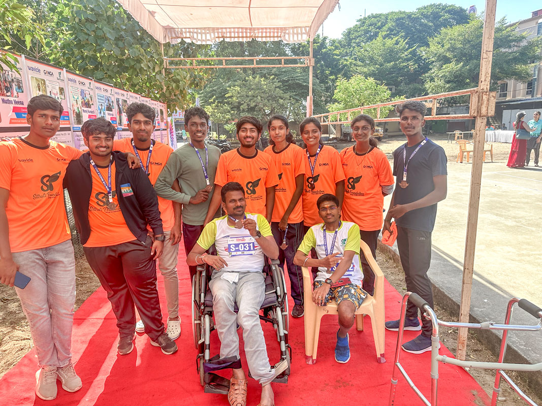 Rotaractors with the physically-challenged participants of the Run for Wheels marathon.
