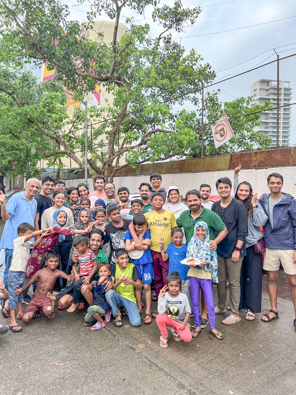 RAC Parleshwar Genz members along with children at a slum colony in Bandra, Mumbai, during Project Yaariyan. Club president Yash Mitra is 7th from left.