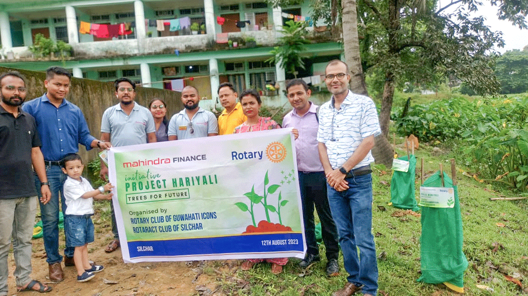 RAC Silchar president Prasenjit Debnath (centre) with Rotarians and staff of Mahendra Finance in one of the venues where saplings were planted.